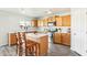 Modern kitchen with wood cabinets, stainless steel appliances, and an island at 28125 N Silver Ln, San Tan Valley, AZ 85143