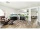 Living room with hardwood floors, large fish tanks, and comfy chair at 28125 N Silver Ln, San Tan Valley, AZ 85143