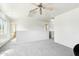 Bright loft area with gray carpet and a ceiling fan at 28125 N Silver Ln, San Tan Valley, AZ 85143