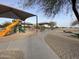 Community playground with play structures and shaded areas at 28125 N Silver Ln, San Tan Valley, AZ 85143