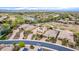 Scenic aerial shot of desert community with lake, golf course, and homes with efficient solar panels at 28247 N 128Th Dr, Peoria, AZ 85383