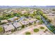 Panoramic aerial view of desert community, golf course, and homes with efficient solar panels at 28247 N 128Th Dr, Peoria, AZ 85383