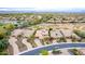 Scenic aerial shot of desert community with lake, golf course, and homes with efficient solar panels at 28247 N 128Th Dr, Peoria, AZ 85383