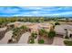 An aerial view captures the property's manicured landscaping, solar panels, and convenient location at 28247 N 128Th Dr, Peoria, AZ 85383