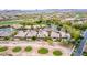 Panoramic aerial view of desert community, golf course, and homes with efficient solar panels at 28247 N 128Th Dr, Peoria, AZ 85383