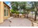 A fully equipped outdoor kitchen with a built-in grill on the large backyard patio at 28247 N 128Th Dr, Peoria, AZ 85383