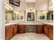 Luxurious bathroom with double vanity, large mirrors, and great lighting fixtures at 28247 N 128Th Dr, Peoria, AZ 85383