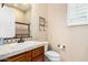 Well-lit bathroom features a vanity with tile countertop and framed mirror with an enclosed tile shower at 28247 N 128Th Dr, Peoria, AZ 85383