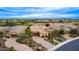 Expansive desert home with lovely landscaping, paved driveway, and tile roof in a beautiful community at 28247 N 128Th Dr, Peoria, AZ 85383