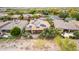 Wide aerial view of home in desert neighborhood with landscaped backyard and efficient solar panel array at 28247 N 128Th Dr, Peoria, AZ 85383