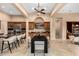 Spacious kitchen with an island, stainless steel appliances, and dark wood cabinets at 28247 N 128Th Dr, Peoria, AZ 85383