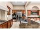 Gourmet kitchen boasts stainless steel appliances and custom wood cabinetry at 28247 N 128Th Dr, Peoria, AZ 85383