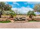 Landscaped backyard features a rock water feature and mature trees. Perfect for outdoor enjoyment at 28247 N 128Th Dr, Peoria, AZ 85383