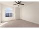 Bright bedroom with carpeted floor and ceiling fan at 3258 E Dover St, Mesa, AZ 85213