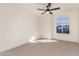 Well-lit bedroom featuring an arched window and neutral tones at 3258 E Dover St, Mesa, AZ 85213