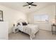 Bright bedroom with a queen-size bed and ample natural light at 3258 E Dover St, Mesa, AZ 85213