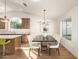 Dining room with modern chandelier and seating for six at 3258 E Dover St, Mesa, AZ 85213