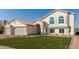 Two-story home with a three-car garage and well-manicured lawn at 3258 E Dover St, Mesa, AZ 85213