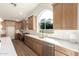 Modern kitchen with light wood cabinets, white backsplash and stainless steel appliances at 3258 E Dover St, Mesa, AZ 85213