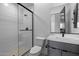 Modern bathroom with a glass shower and floating vanity at 34045 N Borgata Trl, Queen Creek, AZ 85144