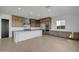 Modern kitchen with island and stainless steel appliances at 34045 N Borgata Trl, Queen Creek, AZ 85144