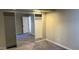 Bedroom with mirrored closet doors and carpeted floors at 3405 W Danbury Dr # D121, Phoenix, AZ 85053