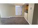 Bright living room with grey carpet and large window at 3405 W Danbury Dr # D121, Phoenix, AZ 85053