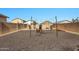 Backyard with firepit and string lights, ready for entertaining at 35298 W San Ildefanso Ave, Maricopa, AZ 85138