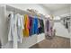 Walk-in closet with ample shelving and hanging space at 35298 W San Ildefanso Ave, Maricopa, AZ 85138