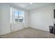 Bright dining area with large window and tile flooring at 35298 W San Ildefanso Ave, Maricopa, AZ 85138