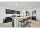 Modern kitchen with granite countertops and stainless steel appliances at 35298 W San Ildefanso Ave, Maricopa, AZ 85138