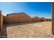 Large, unlandscaped backyard with a block wall at 3923 W Hayduk Rd, Laveen, AZ 85339