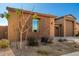 Landscaped yard with attractive stone accents and a two-car garage at 3923 W Hayduk Rd, Laveen, AZ 85339