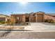 Beautiful two-story home with a three-car garage and desert landscaping at 3923 W Hayduk Rd, Laveen, AZ 85339