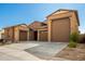 Two story home with three car garage and desert landscaping at 3923 W Hayduk Rd, Laveen, AZ 85339