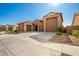 Modern home with a three car garage and clean lines at 3923 W Hayduk Rd, Laveen, AZ 85339