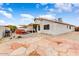 Flagstone patio, hot tub, and covered patio area at 40136 N Costa Del Sol Dr, San Tan Valley, AZ 85140