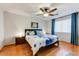 Bedroom with wood flooring and ceiling fan at 40136 N Costa Del Sol Dr, San Tan Valley, AZ 85140