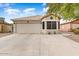 House exterior with two-car garage and bay window at 40136 N Costa Del Sol Dr, San Tan Valley, AZ 85140