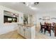 Kitchen island with granite countertops and white shaker cabinets at 40136 N Costa Del Sol Dr, San Tan Valley, AZ 85140