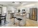 Modern kitchen with island, stainless steel appliances, and granite countertops at 40136 N Costa Del Sol Dr, San Tan Valley, AZ 85140