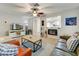 Bright and airy living room with fireplace and built-in shelving at 40136 N Costa Del Sol Dr, San Tan Valley, AZ 85140