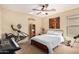 Cozy bedroom with ceiling fan, neutral walls, carpet flooring, and ample natural light at 42531 W Chisholm Dr, Maricopa, AZ 85138