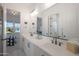 Modern bathroom with double vanity, and bedroom view at 4752 S Orbit Ave, Mesa, AZ 85212