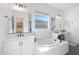 Elegant bathroom with double vanity and free-standing tub at 4752 S Orbit Ave, Mesa, AZ 85212