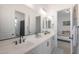 Modern bathroom with double vanity, and view of bedroom at 4752 S Orbit Ave, Mesa, AZ 85212