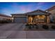 Charming single-story home with neutral gray exterior, brick driveway, manicured landscape, and covered porch at 4752 S Orbit Ave, Mesa, AZ 85212