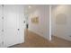 Bright hallway with light wood flooring and white doors at 4752 S Orbit Ave, Mesa, AZ 85212