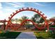 Vibrant community playground featuring a unique orange climbing structure and inviting green spaces at 4752 S Orbit Ave, Mesa, AZ 85212