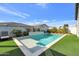 Inviting rectangular pool with a tanning shelf and lush landscaping at 4752 S Orbit Ave, Mesa, AZ 85212